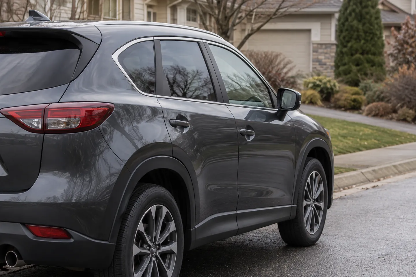 A parked car beside a residential driveway